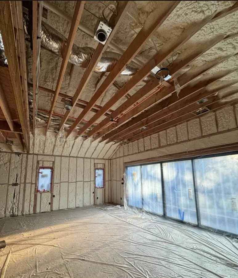 Interior walls and ceiling insulated with spray foam during new construction in Menasha